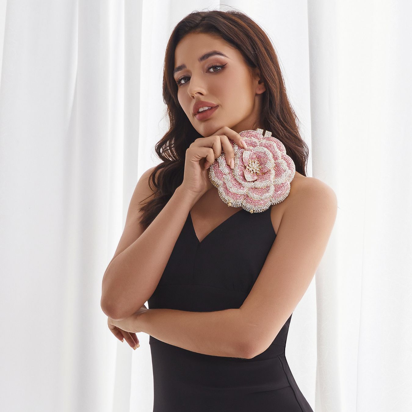 Woman holding 3D flower beaded clutch at formal event – ARLANA