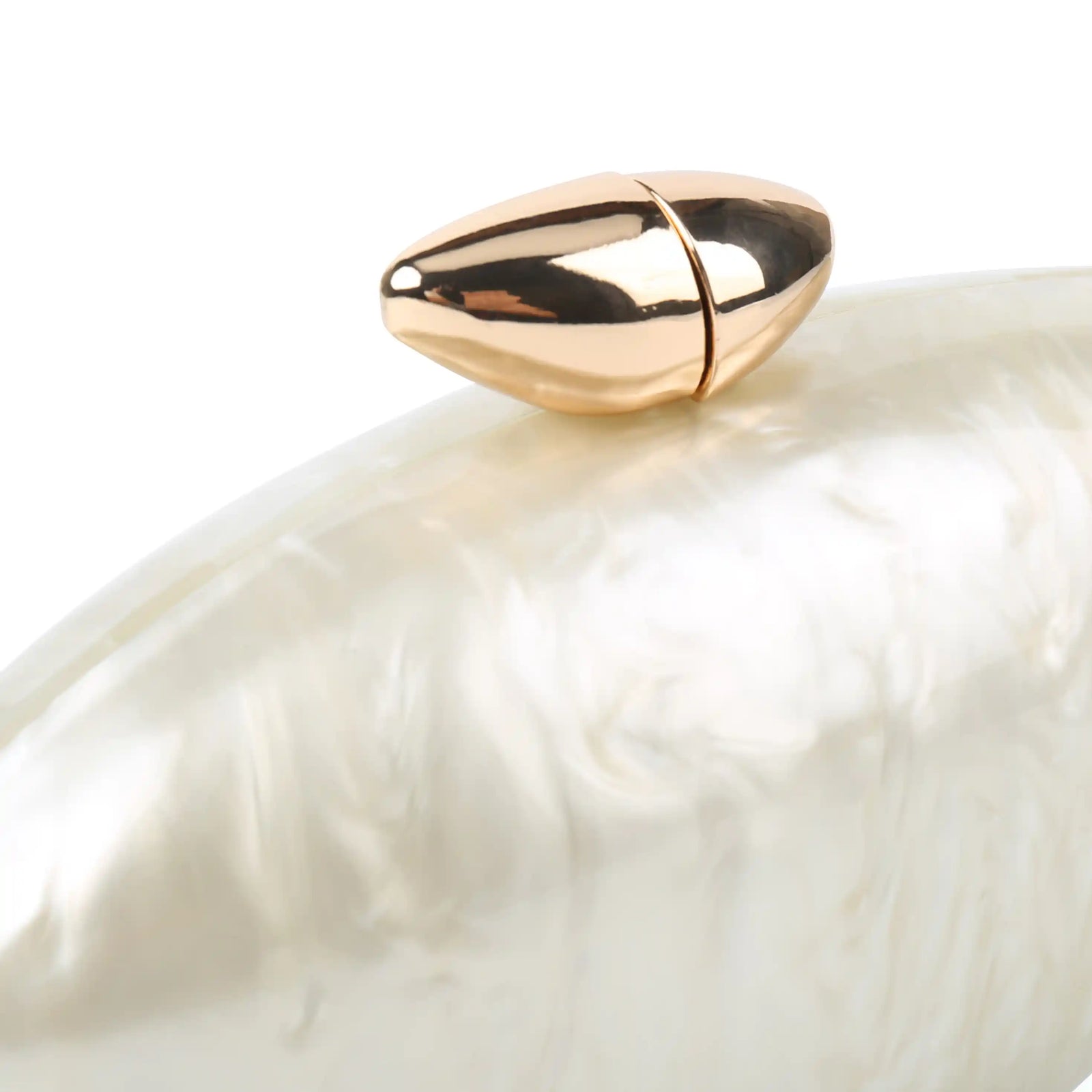 Close-up of iridescent pearlescent surface of oval clutch – ARLANA