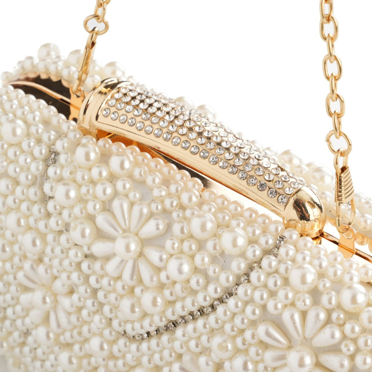 Close-up of pearl bead and quilted texture on ivory clutch – ARLANA