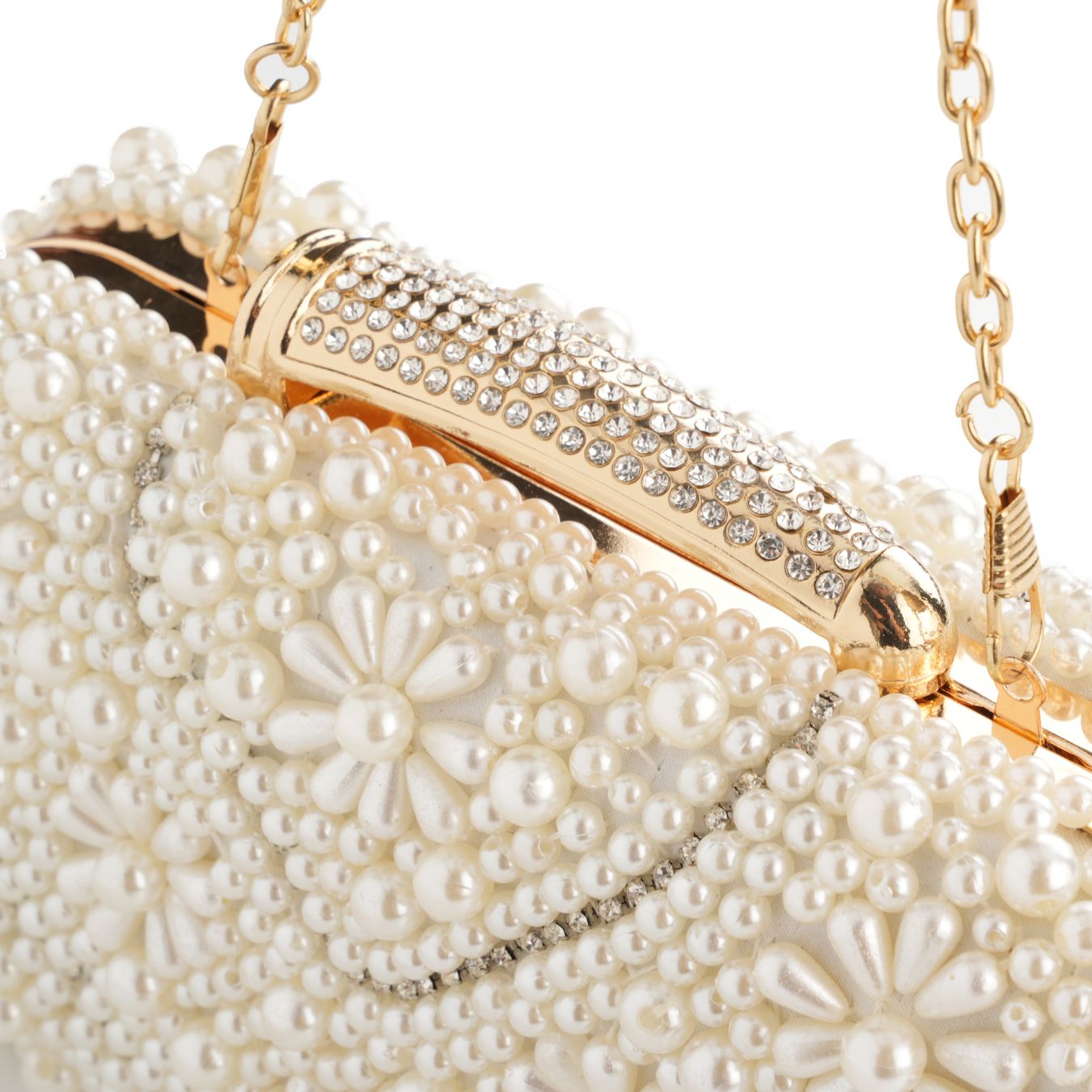 Close-up of pearl bead and quilted texture on ivory clutch – ARLANA