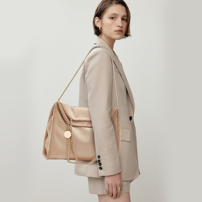 Woman carrying microfiber chain tote on shoulder – ARLANA