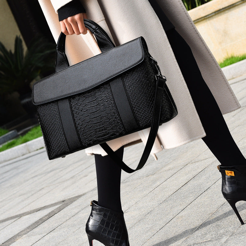 Woman carrying croc embossed black work tote – ARLANA
